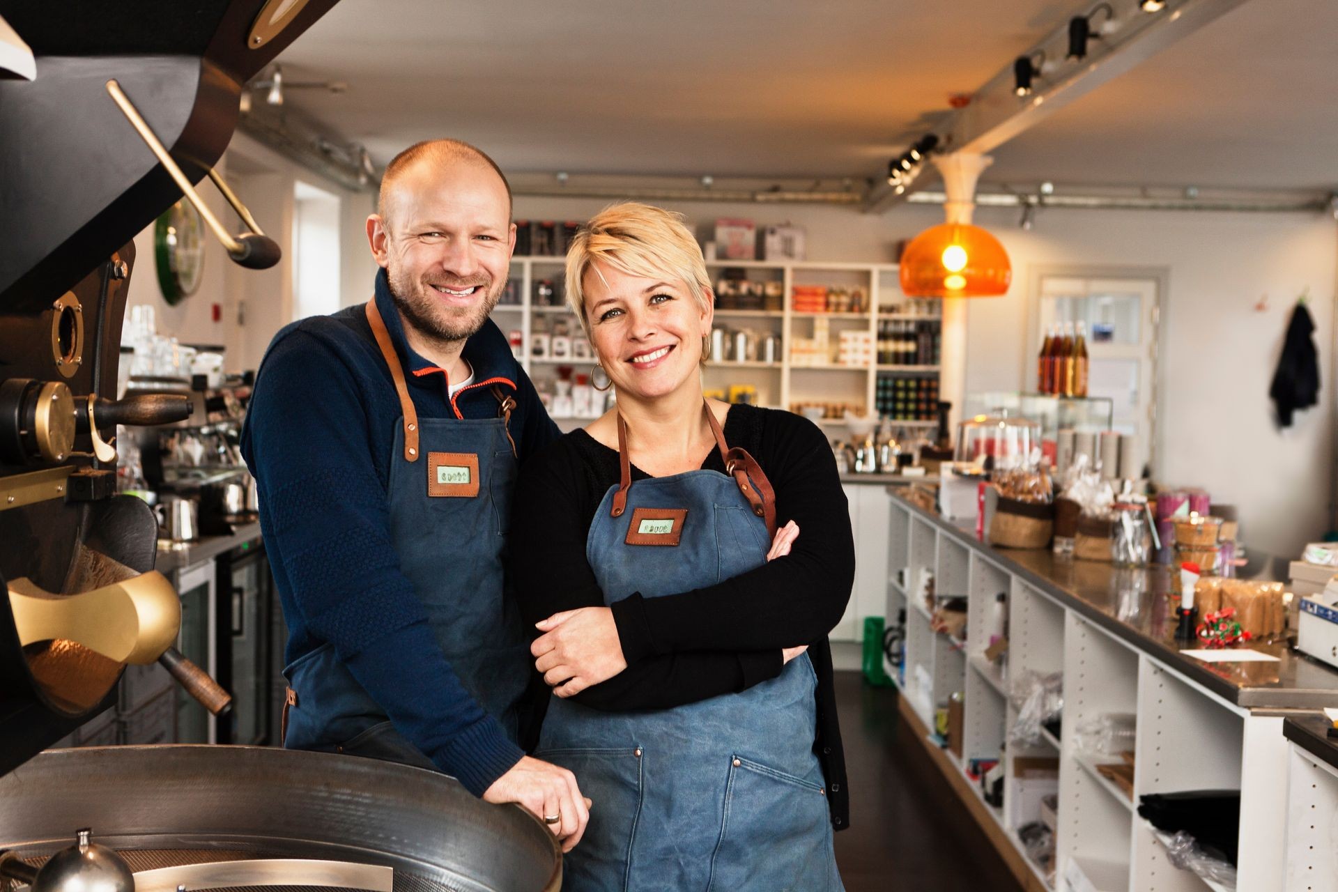 Mature couple in coffee shop kitchen